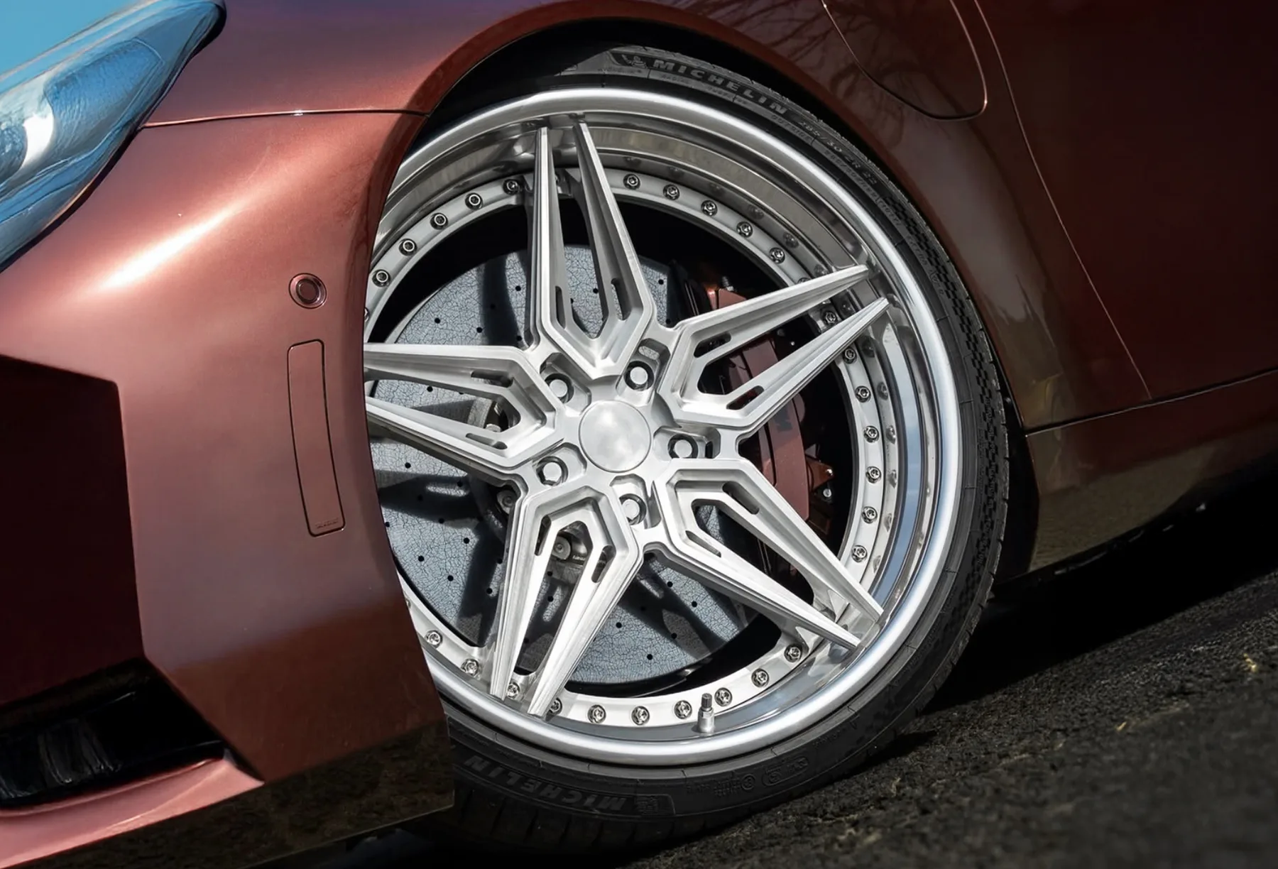 URBANLUGS forged wheel in polished 6-spoke design on a bronze car